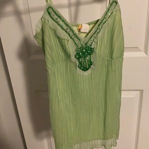 green frilly tank top